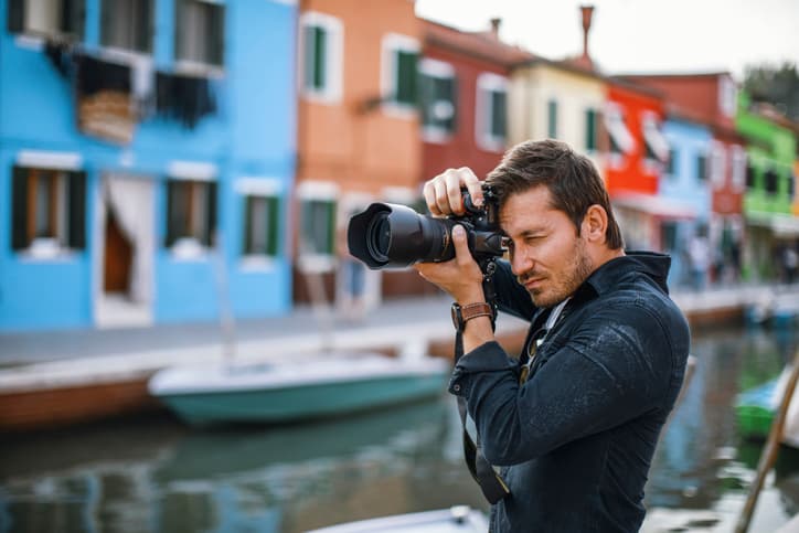 Photographer taking pictures with a professional camera
