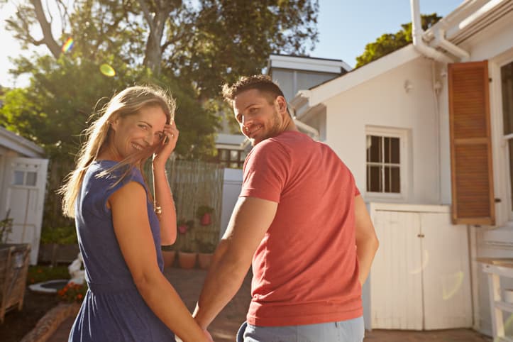 Couple walking up to a house for a showing