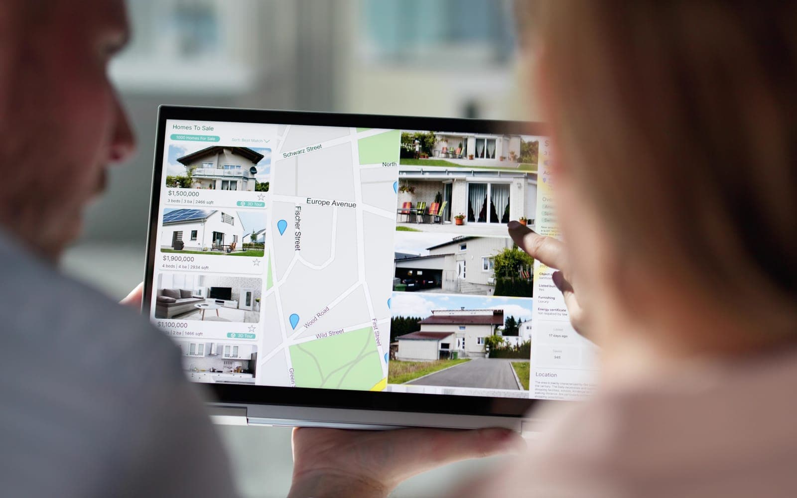 Couple browsing home listings and a map on a tablet