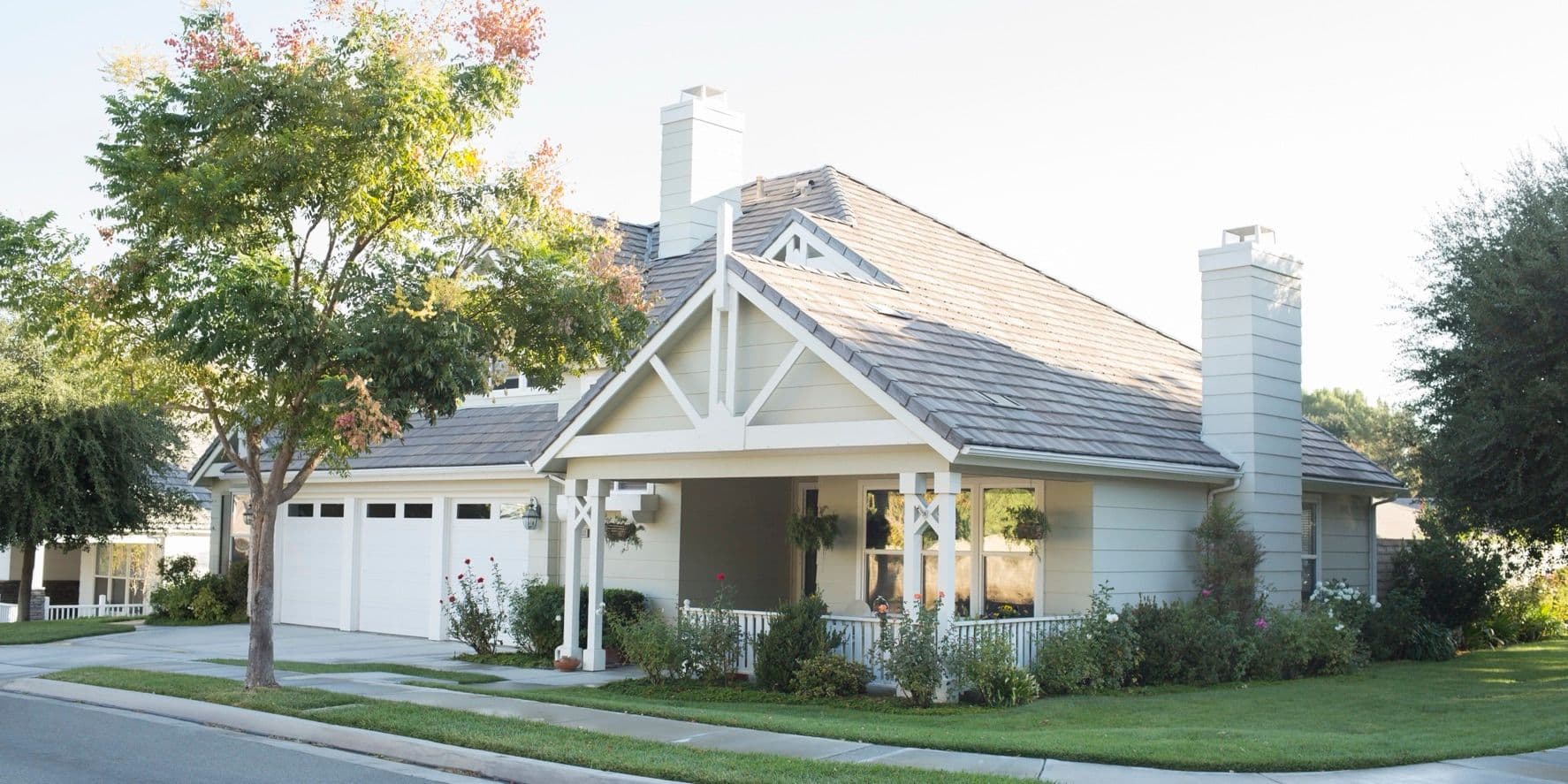 Single-story home with a front porch on a quiet street
