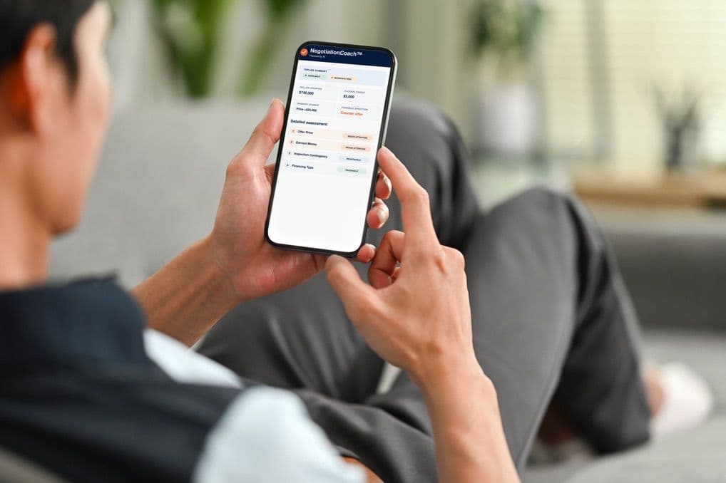 Man relaxing on his sofa while he reviews an offer on his phone