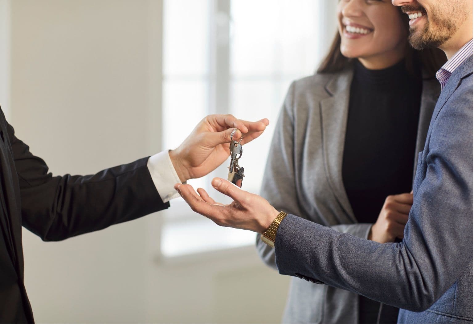 Couple receiving the keys to their new home